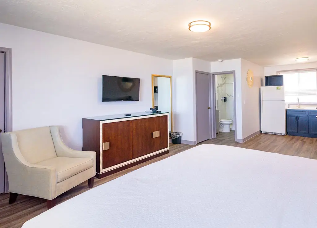 King bed in a first-floor oceanfront room at Outer Banks Motor Lodge