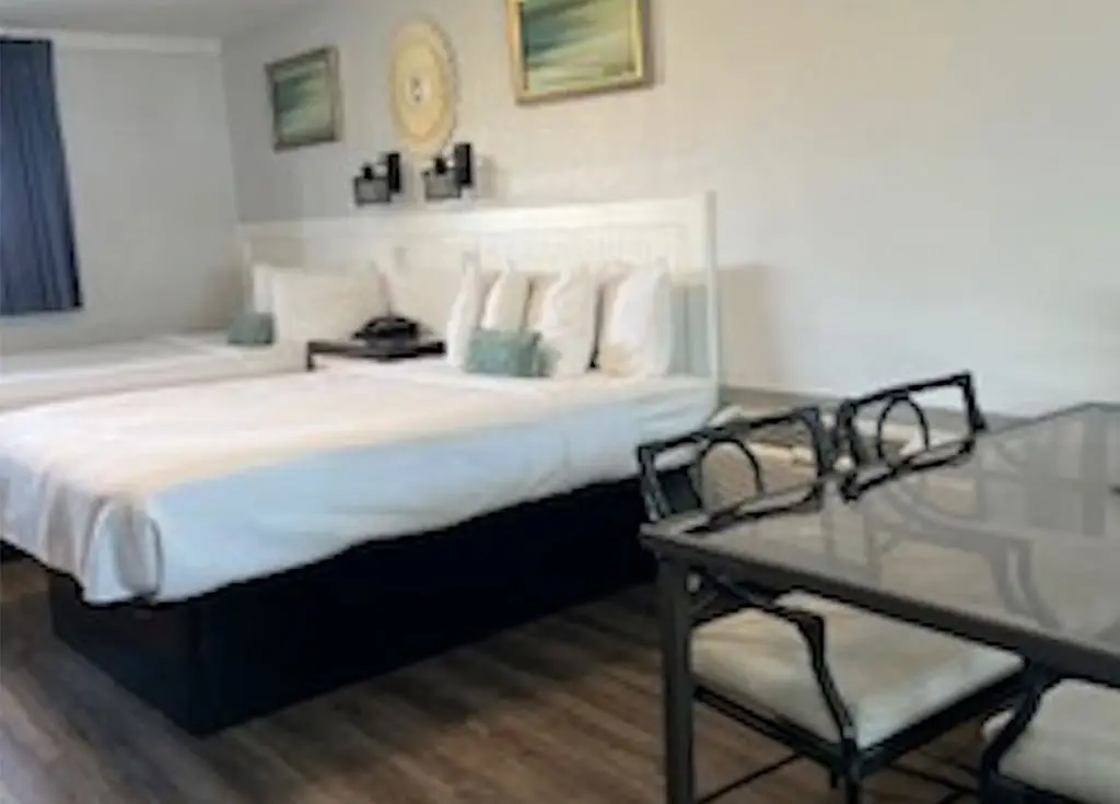 Queen bed in a first-floor oceanfront two-room unit