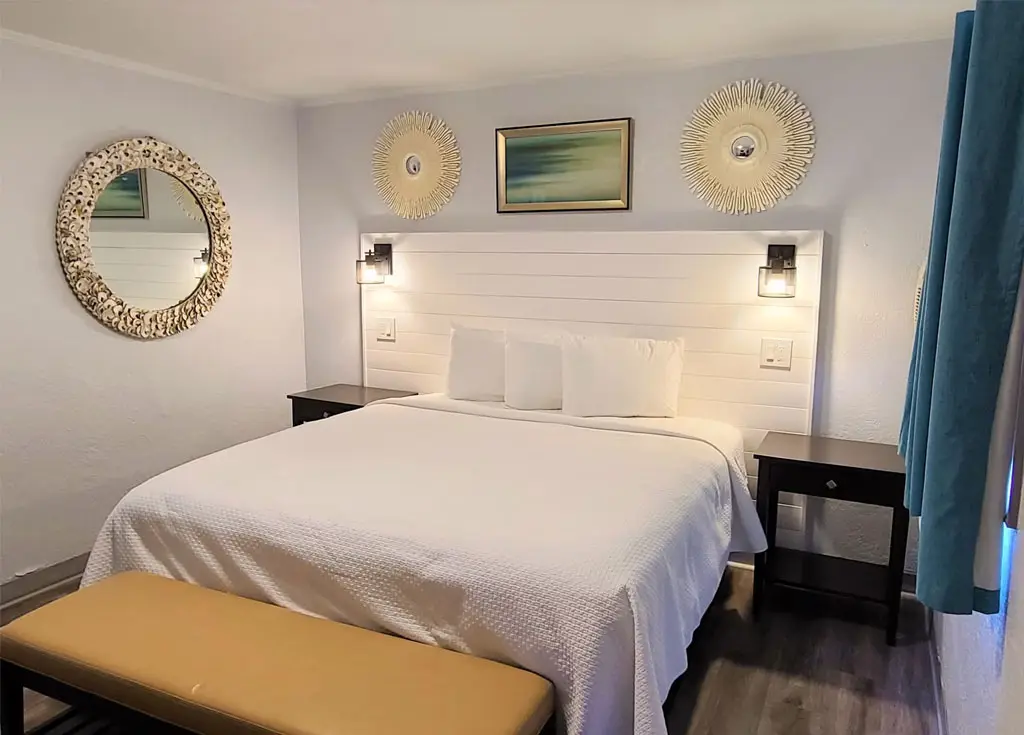 King bed in a poolside room at Outer Banks Motor Lodge