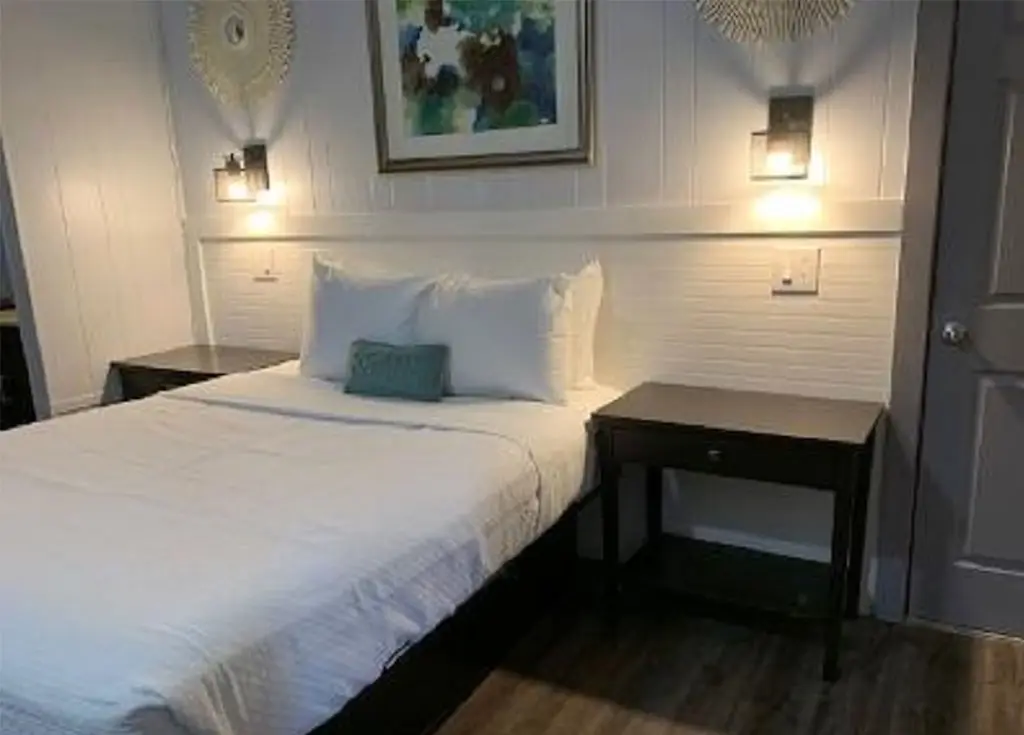 King bed in a pet-friendly poolside patio room